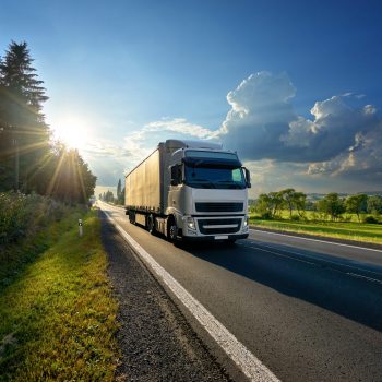 Truck travelling down a road