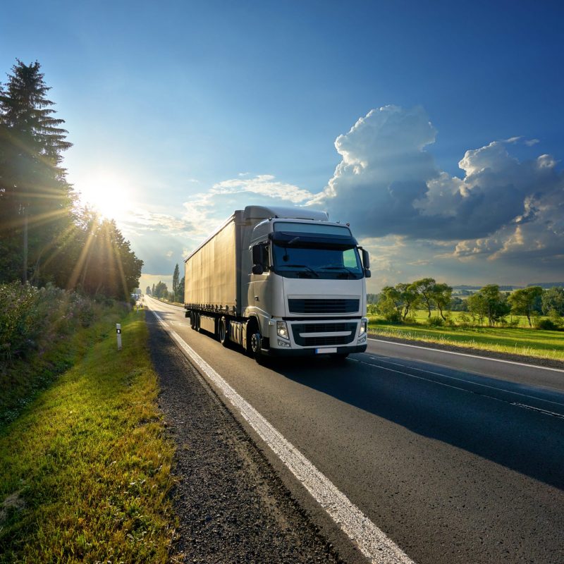Truck travelling down a road